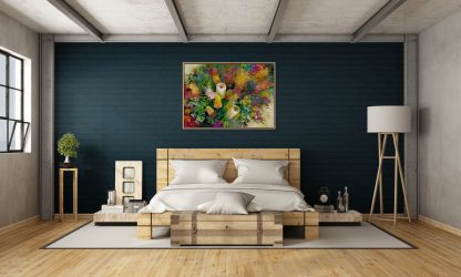 A timber and cream bedroom with a deep blue wall and a painting of flowers